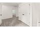 Bright hallway with carpet, doors to bedrooms and closets at 180 Bowman Rd, Statesville, NC 28625