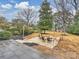 Stone patio with fire pit and seating area at 2013 Tyvola Rd, Charlotte, NC 28210