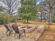 Stone patio with fire pit and seating area at 2013 Tyvola Rd, Charlotte, NC 28210