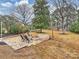 Stone patio with fire pit and seating area at 2013 Tyvola Rd, Charlotte, NC 28210