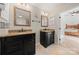 Bathroom featuring dual vanity sinks with black cabinets and modern lighting at 204 Riverview Ter, Lake Wylie, SC 29710