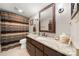 Well lit bathroom with a granite countertop and a decorative framed mirror at 204 Riverview Ter, Lake Wylie, SC 29710
