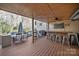 Outdoor deck featuring a bar area, grill, and seating for entertaining guests at 204 Riverview Ter, Lake Wylie, SC 29710
