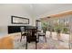 Bright dining room with large windows, a wood ceiling accent and stylish decor at 204 Riverview Ter, Lake Wylie, SC 29710