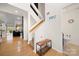 Bright foyer with hardwood floors, a modern staircase, and convenient access to a half-bath at 204 Riverview Ter, Lake Wylie, SC 29710