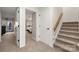 Hallway leading to a bedroom, featuring a staircase with a wooden banister at 204 Riverview Ter, Lake Wylie, SC 29710