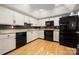 Well-lit kitchen with stainless steel appliances, granite countertops, and classic white cabinets at 204 Riverview Ter, Lake Wylie, SC 29710