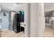 Tiled laundry room with stackable washer and dryer, adjacent to hallway at 204 Riverview Ter, Lake Wylie, SC 29710