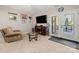 Finished basement living room with comfortable seating and access to outdoor deck at 204 Riverview Ter, Lake Wylie, SC 29710