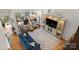 Overhead shot of a cozy living room with hardwood floors and a blue sofa at 204 Riverview Ter, Lake Wylie, SC 29710