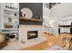 Living room with fireplace, built-ins, and kitchen peek at 204 Riverview Ter, Lake Wylie, SC 29710