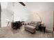Comfortable sitting area with a gray sofa, desk, and natural lighting at 204 Riverview Ter, Lake Wylie, SC 29710