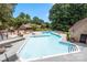 Community pool offers a refreshing escape, surrounded by lounge chairs and umbrellas at 204 Riverview Ter, Lake Wylie, SC 29710