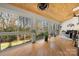 Light-filled sunroom with hardwood floors and large windows providing scenic views at 204 Riverview Ter, Lake Wylie, SC 29710
