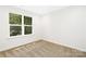 Simple bedroom with large window and neutral walls at 2113 Gemway Dr, Charlotte, NC 28216