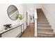 Clean entryway with hardwood floors and a modern staircase at 2113 Gemway Dr, Charlotte, NC 28216