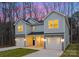 Two-story home with gray siding and two-car garage at 2113 Gemway Dr, Charlotte, NC 28216