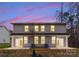 Rear view of two-story home with private patio at 2113 Gemway Dr, Charlotte, NC 28216