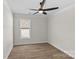 Bright bedroom with wood-look floors and ceiling fan at 2151 Black Forest Cv, Concord, NC 28027