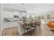 Modern kitchen with white cabinets, granite countertops, and a kitchen island at 2151 Black Forest Cv, Concord, NC 28027