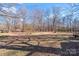 Large backyard with mature trees and open space at 217 E Old Highway 74 Hwy # 4, Monroe, NC 28112