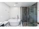 Updated bathroom featuring a soaking tub and a walk-in shower at 217 E Old Highway 74 Hwy # 4, Monroe, NC 28112