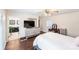 Well-lit bedroom with private bathroom access and dark hardwood floors at 217 E Old Highway 74 Hwy # 4, Monroe, NC 28112
