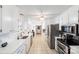 Bright eat-in kitchen with stainless steel appliances and white cabinetry at 217 E Old Highway 74 Hwy # 4, Monroe, NC 28112