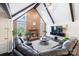 Vaulted ceiling and hardwood floors highlight this Gathering-friendly living room at 217 E Old Highway 74 Hwy # 4, Monroe, NC 28112