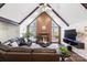 Open floor plan living room features a high ceiling and a fireplace at 217 E Old Highway 74 Hwy # 4, Monroe, NC 28112