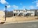 Two-story townhome with neutral siding and a grassy front yard at 241 Century Dr, Salisbury, NC 28147