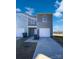 Side view of townhome showing detached garage and grassy area at 241 Century Dr, Salisbury, NC 28147