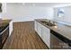 Kitchen island with granite countertops and stainless steel dishwasher at 241 Century Dr, Salisbury, NC 28147