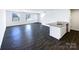 Open concept kitchen and living area with granite island and vinyl plank flooring at 241 Century Dr, Salisbury, NC 28147