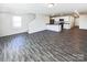 Open concept living area with gray wood-look floors and island kitchen at 241 Century Dr, Salisbury, NC 28147