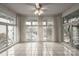 Bright sunroom with tile floors and large windows at 2501 Roswell Ave # 307, Charlotte, NC 28209