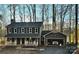 Two-story house with gray siding, white porch, and attached garage at 2817 Desmond Pl, Charlotte, NC 28210