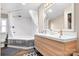 Bathroom with a double vanity and a corner shower at 311 Chase Dr, Iron Station, NC 28080