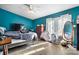 Teal bedroom with double bed and access to backyard at 4345 Fish Pond Rd, Salisbury, NC 28146