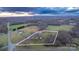 Aerial view of a house on a large lot with surrounding farmland at 50 Berea Church Quincy Rd, Hiddenite, NC 28636