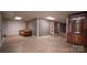 Spacious finished basement with large room and built-in shelving at 50 Berea Church Quincy Rd, Hiddenite, NC 28636