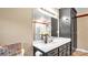 Bathroom with dark gray vanity, mirror, and wicker basket at 50 Berea Church Quincy Rd, Hiddenite, NC 28636