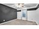 Bedroom with gray and white walls, ceiling fan, and carpeting at 50 Berea Church Quincy Rd, Hiddenite, NC 28636