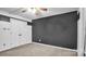 Bedroom with gray walls, ceiling fan, double doors, and carpeting at 50 Berea Church Quincy Rd, Hiddenite, NC 28636