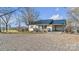 Newly renovated home with metal roof and gravel driveway at 50 Berea Church Quincy Rd, Hiddenite, NC 28636