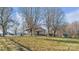Ranch home nestled on a spacious lot with mature trees at 50 Berea Church Quincy Rd, Hiddenite, NC 28636