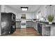 Modern kitchen with gray and white cabinets, granite countertops at 50 Berea Church Quincy Rd, Hiddenite, NC 28636