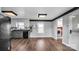 Bright kitchen with gray cabinets, stainless steel appliances, and wood-look flooring at 50 Berea Church Quincy Rd, Hiddenite, NC 28636