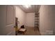 Basement storage room with shelving and water heater at 50 Berea Church Quincy Rd, Hiddenite, NC 28636