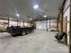Spacious workshop with high ceilings and a large roll-up door at 50 Berea Church Quincy Rd, Hiddenite, NC 28636